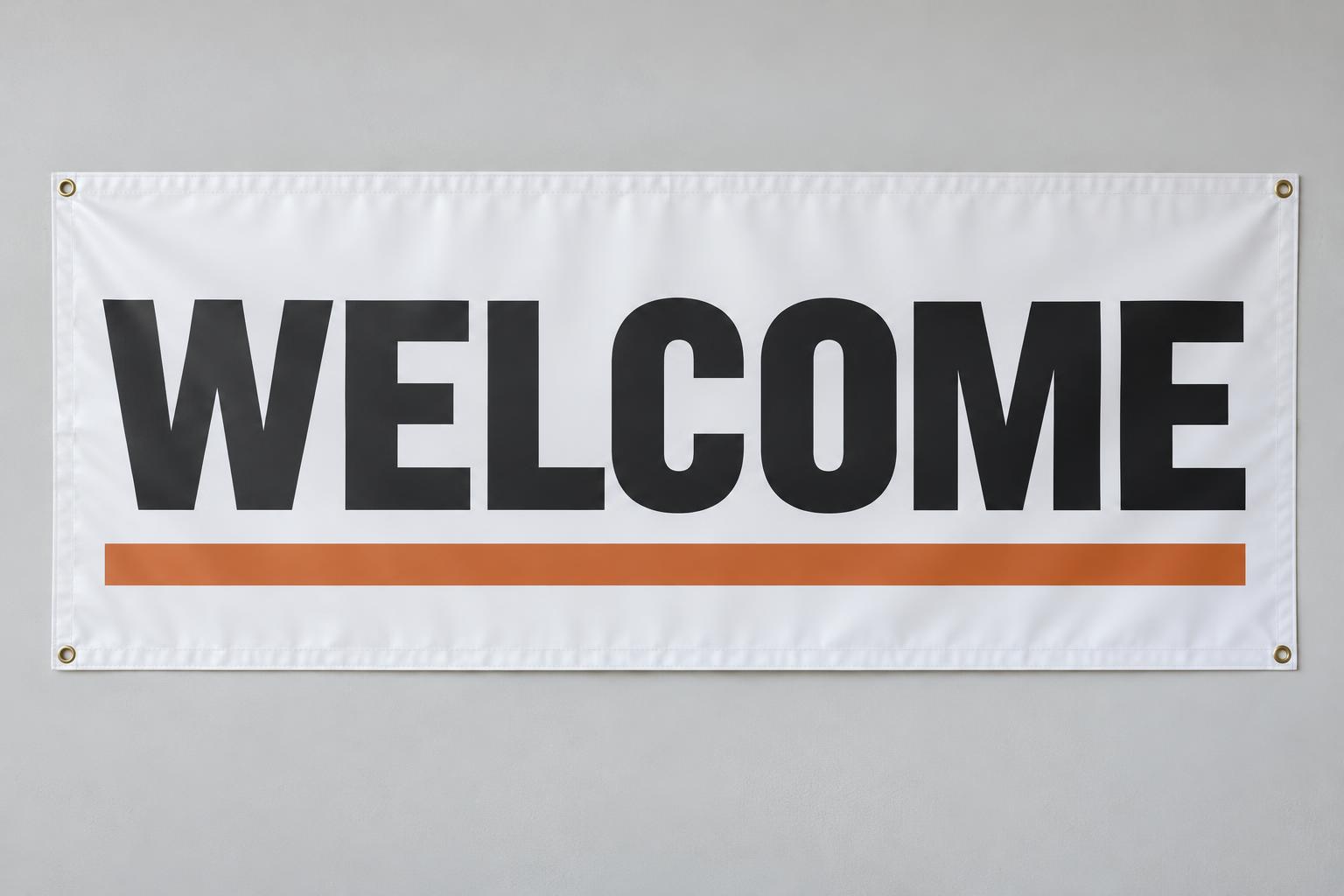 Illustrative white welcome banner with hemmed edges and metal grommets